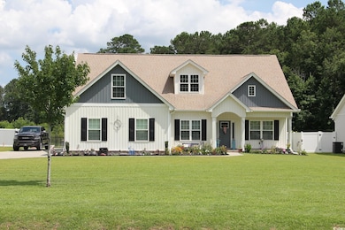 View of front of property featuring a shingled roof