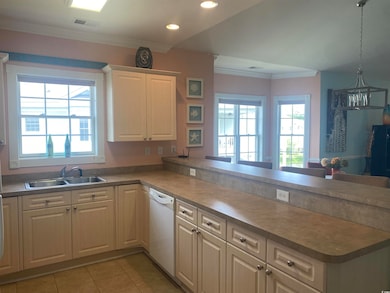 Kitchen with light tile patterned floors, white di