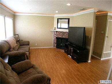 Large living room:  New laminate, crown molding an