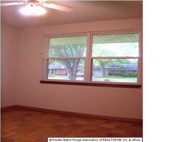 The front bedroom looks out into the front yard.