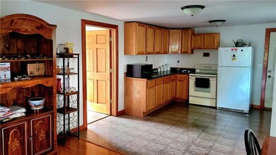 What a nice kitchen.  The door on the left goes into its own laundry room.  This is a large nice home.