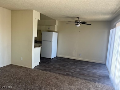 Kitchen with freestanding refrigerator, ceiling fa