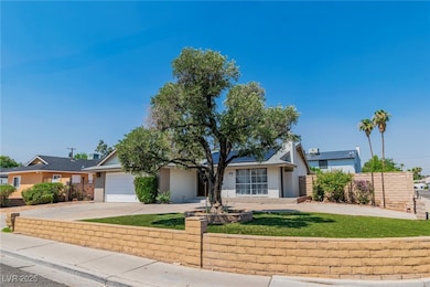 View of front of property with driveway, solar pan