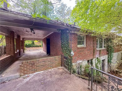 View of property exterior with brick siding