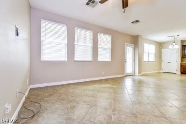 Unfurnished living room with ceiling fan and light