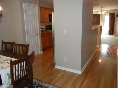 Entry. Nice open feeling from the entry, notice the gleaming hardwood floors. Main level powder room has HW floors and a pedestal sink.