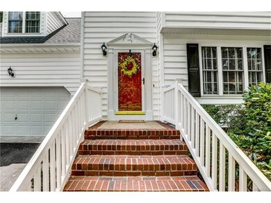 Traditional style, pretty white home with black sh
