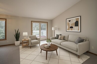 Virtually staged.  Southern exposure offers plenty of daylight.  Nice high vaulted ceiling.  Pull down shades on door leading to the deck.