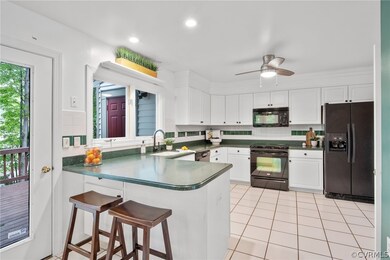 Tile floor, solid surface counters, an eat up bar