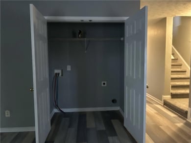 Washroom featuring hookup for an electric dryer, l