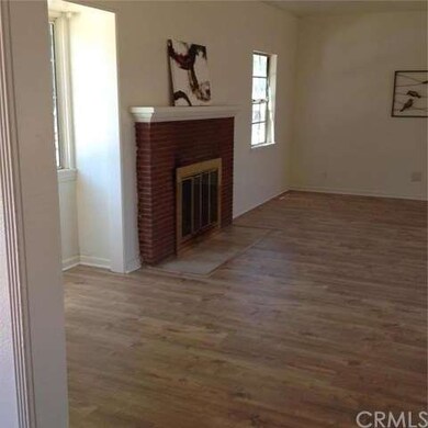 From entry, the fireplace and another bay window. 