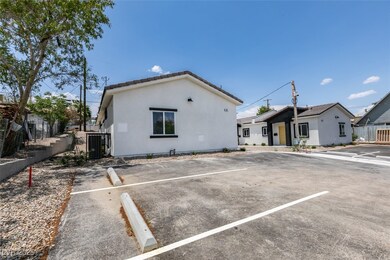 View of front of property with uncovered parking,