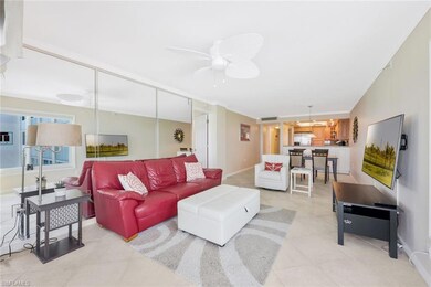 Living room featuring ceiling fan and tile floors