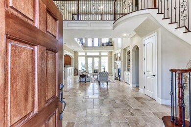Your front door opens to an inspiring two story entry and living space.
