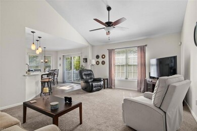 Living room featuring vaulted ceiling, a high ceil