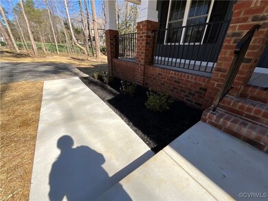 View of side of property with brick siding