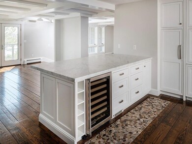 The kitchen is open to the dining...