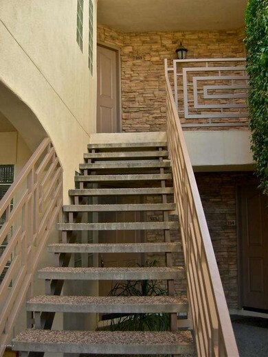Entrance to 213 off carport