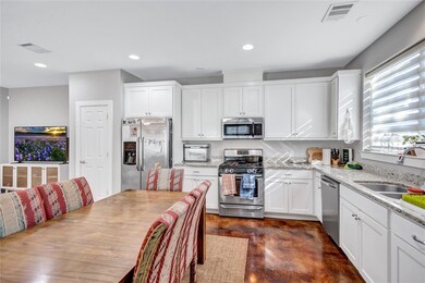 Kitchen featuring appliances with stainless steel