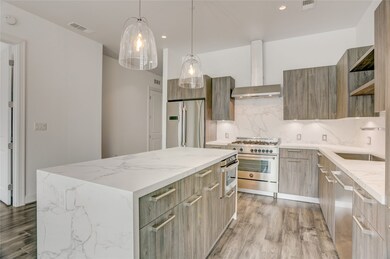 This kitchen features a modern, sleek design with