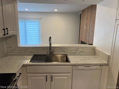 Kitchen featuring white cabinets, white dishwasher, stainless steel electric stove, recessed lighting, and light stone counters