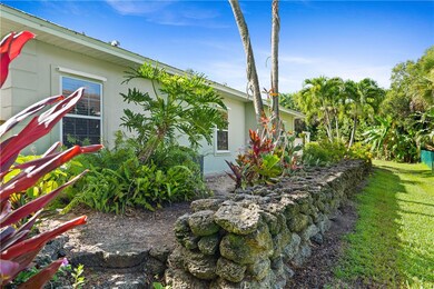30 tons of coquina rock for wall and side path.