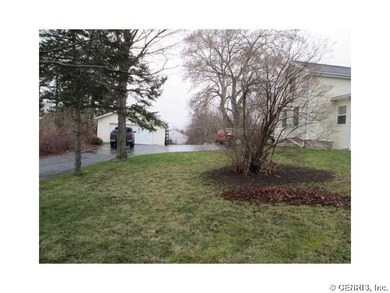 Exterior Back. DETACHED GARAGE AND BLACKTOP DRIVEW