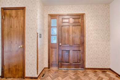 Upon entering you will be greeted by a spacious fo