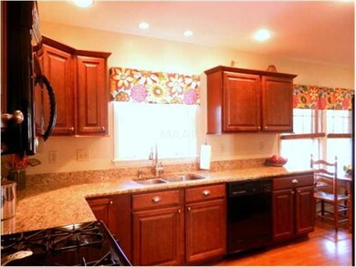 Renovated kitchen features granite, handsome cabin