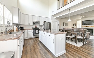 Tons of classic white cabinetry with large center