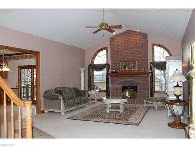 The great room has a floor-to-ceiling brick firepl