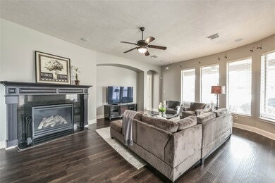 family room with wall of windows over looking the pool