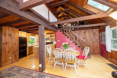 Dining area open to kitchen and views of back deck