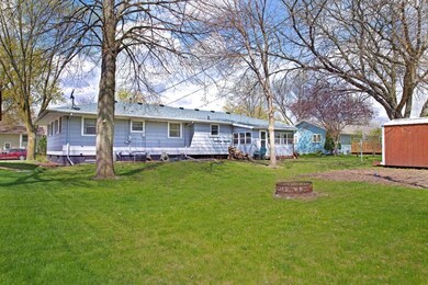 Backyard with garden area, sun porch off the garag