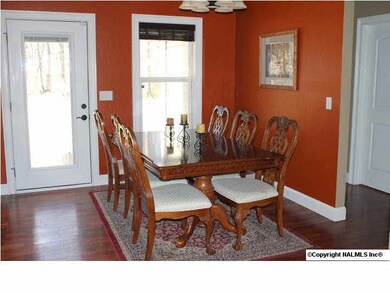 Dining area with door out to covered porch