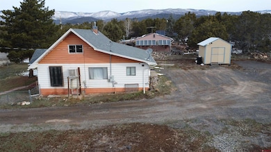View of front of house featuring an outbuilding, f