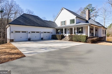 Front of Main Home featuring deep 3-car garages