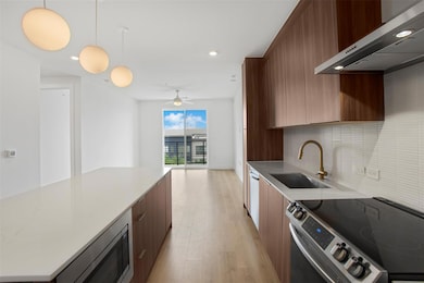 Kitchen with light wood-style flooring, a sink, a
