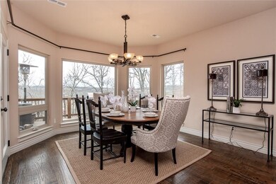Oversized Elegant Eating Area offers Bay of Windows and Glass Door accessing the Upper Deck
