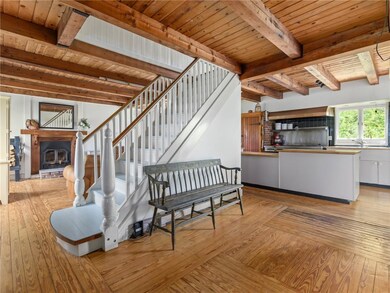 Main entryway to house. The ceilings are wood beam
