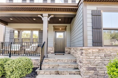 Doorway to property featuring a porch