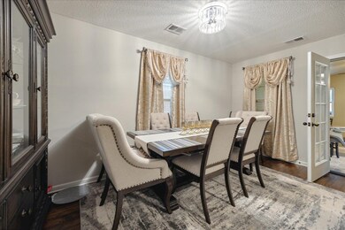 Dining space featuring french doors, hardwood / wo