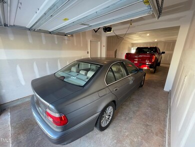Cars parked in oversized 2.5 car garage.