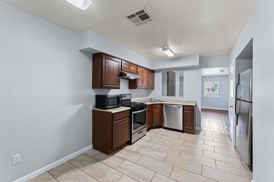 Kitchen featuring appliances with stainless steel