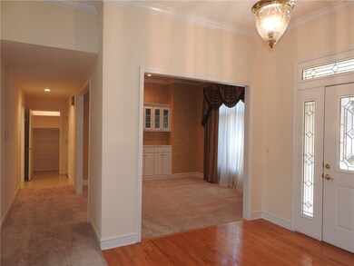 Entry foyer view into dining room