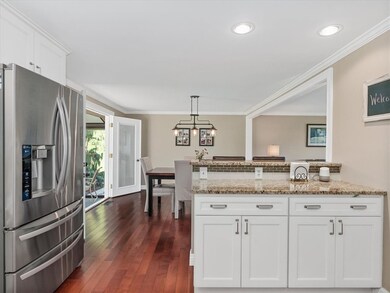 Look out from the kitchen to the sunroom.  Enjoy t