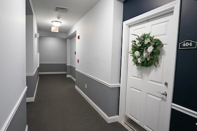 Spicket Commons unit 404, Methuen, MA 01844 - photo 7