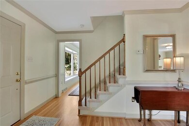 Bright and welcoming foyer, fresh neutral paint, r