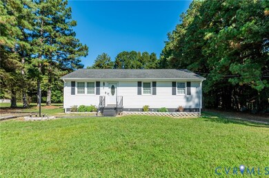 Ranch-style house with a front lawn, crawl space, and view of scattered trees