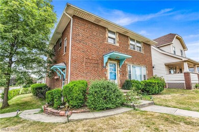 Townhome / multi-family property featuring a front lawn